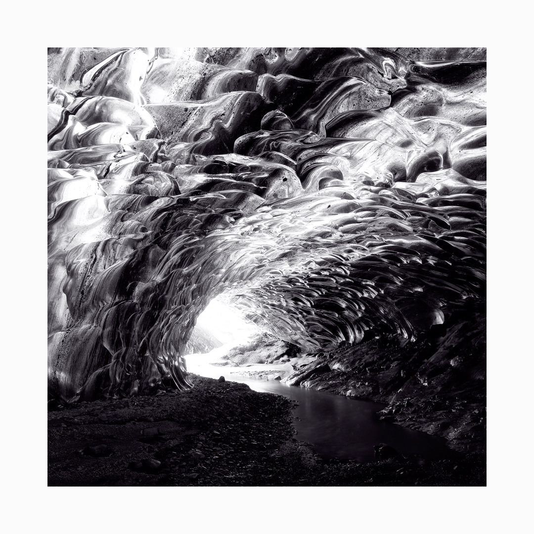 Fine art black and white image of Northern Lights Ice Cave Passage from the Vatnajökull Glacier, Iceland.