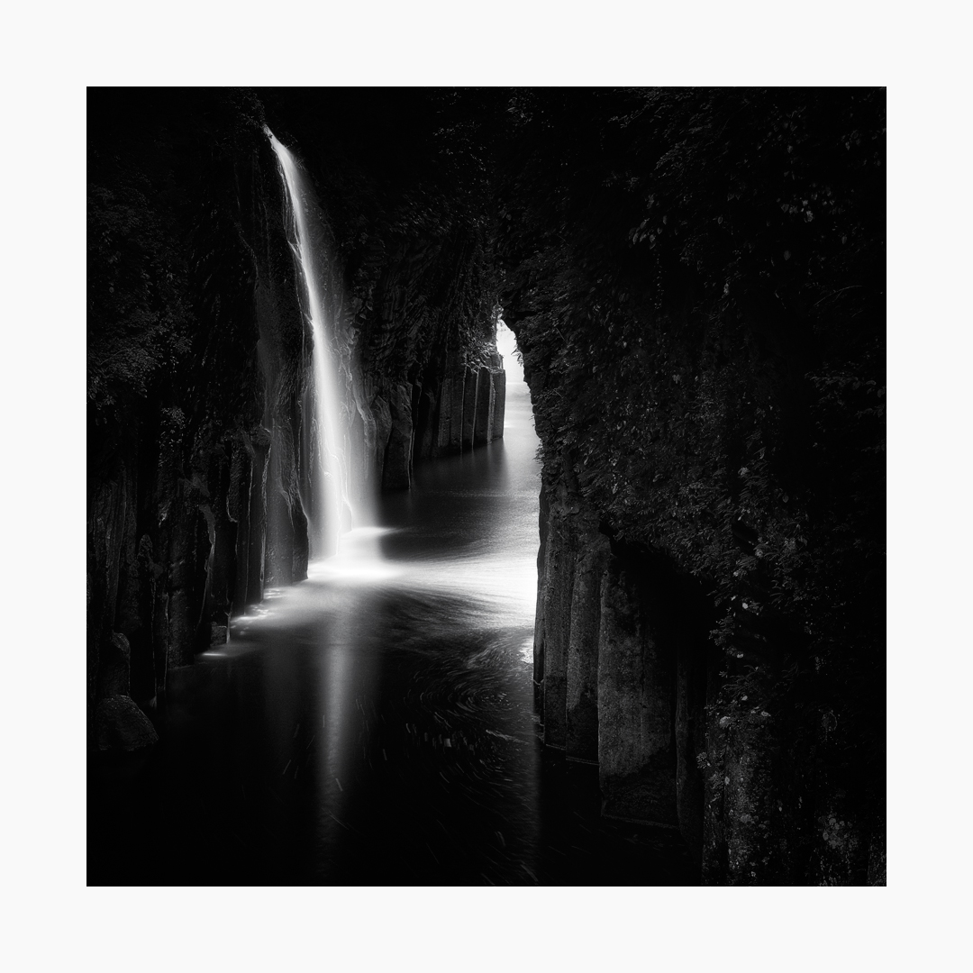 Black and white fine art image of the Manai Falls of Takachiho Gorge, Japan.